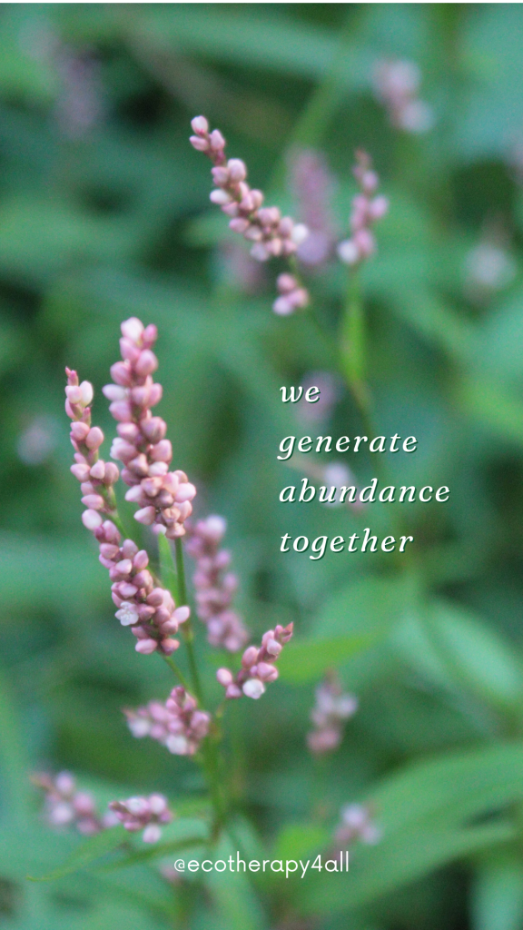 Tiny purple buds surrounded by bright greenery, white text "we generate abundance together"